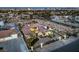 An aerial view of the property shows the home, outbuildings and the Las Vegas skyline at dusk at 2780 El Camino Rd, Las Vegas, NV 89146