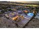 The property is shown in this aerial view, highlighting the pool, guest house, and city lights in the distance at 2780 El Camino Rd, Las Vegas, NV 89146