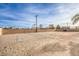 Large, fenced backyard with a sand volleyball court, offering ample space for activities at 2780 El Camino Rd, Las Vegas, NV 89146