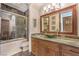 Bathroom features a tub/shower combo and stylish vanity with storage at 2780 El Camino Rd, Las Vegas, NV 89146