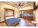 Bedroom featuring a built-in murphy bed, kitchenette, and access to a private outdoor area at 2780 El Camino Rd, Las Vegas, NV 89146