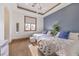 This bedroom features two twin beds, an accent wall, and neutral carpet at 2780 El Camino Rd, Las Vegas, NV 89146