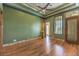 Spacious bedroom featuring hardwood floors, a ceiling fan, recessed lighting, and decorative wall trim at 2780 El Camino Rd, Las Vegas, NV 89146