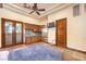 Bedroom featuring kitchenette, stylish lighting, and private patio access at 2780 El Camino Rd, Las Vegas, NV 89146