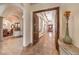 Bright hallway with marble floors, arched doorways, and wood trim with lots of natural light at 2780 El Camino Rd, Las Vegas, NV 89146
