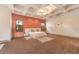 Spacious primary bedroom featuring coffered ceilings, and neutral color palette with large windows and plush carpet at 2780 El Camino Rd, Las Vegas, NV 89146
