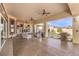 Inviting outdoor living area featuring a fireplace, comfortable seating, and a built-in grill at 2780 El Camino Rd, Las Vegas, NV 89146