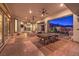 Large covered patio, perfect for entertainment, with ample seating, ceiling fans, and access to the backyard at 2780 El Camino Rd, Las Vegas, NV 89146