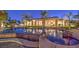 Beautiful backyard pool and spa with lush landscaping, tropical palm trees, and relaxing patio area at 2780 El Camino Rd, Las Vegas, NV 89146