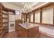 Walk-in closet features built-in shelving, drawers, and a center island at 2780 El Camino Rd, Las Vegas, NV 89146