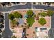 Overhead aerial view of a neighborhood park featuring landscaping, a playground, and mature trees at 2929 Salado Creek Ave, North Las Vegas, NV 89081
