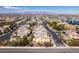 A landscape aerial view of a residential neighborhood with mountain views in the distance at 2929 Salado Creek Ave, North Las Vegas, NV 89081