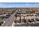 Wide aerial view showcasing the residential neighborhood, street layout, and nearby mountain range at 2929 Salado Creek Ave, North Las Vegas, NV 89081