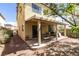 Inviting covered patio area with wood supports, outdoor lighting, and a cozy area for relaxing and entertaining at 2929 Salado Creek Ave, North Las Vegas, NV 89081