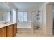 Bright bathroom with tub, shower, vanity, and plenty of natural light at 2929 Salado Creek Ave, North Las Vegas, NV 89081
