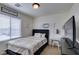 Cozy bedroom with a bed and vanity table bathed in natural light at 2929 Salado Creek Ave, North Las Vegas, NV 89081