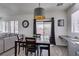 Bright dining area with a modern light fixture, dining table, and natural light, creating a warm ambiance at 2929 Salado Creek Ave, North Las Vegas, NV 89081