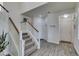 Bright entryway featuring a staircase, white walls, wood-look floors, and a front door at 2929 Salado Creek Ave, North Las Vegas, NV 89081