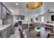 Bright kitchen with gray cabinets, stainless appliances, and an open layout to the living area, perfect for entertaining at 2929 Salado Creek Ave, North Las Vegas, NV 89081