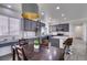 Stylish kitchen featuring gray cabinets, a center island with seating, and modern appliances at 2929 Salado Creek Ave, North Las Vegas, NV 89081