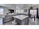 Open living space featuring recessed lighting, dining area, and a kitchen island with barstool seating at 2929 Salado Creek Ave, North Las Vegas, NV 89081