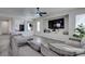 Spacious living room featuring a large gray sectional and a recessed TV at 2929 Salado Creek Ave, North Las Vegas, NV 89081