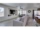 Open-concept living space with recessed lighting, neutral walls, and a large sectional sofa with views to the kitchen at 2929 Salado Creek Ave, North Las Vegas, NV 89081