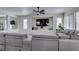 Comfortable living room with a large gray sectional, perfect for relaxation at 2929 Salado Creek Ave, North Las Vegas, NV 89081