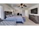 Spacious main bedroom with a king-size bed and dresser at 2929 Salado Creek Ave, North Las Vegas, NV 89081