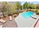 Resort-style backyard with a pool, spa, sun loungers, and well-maintained landscaping at 366 Rancho La Costa St, Las Vegas, NV 89138