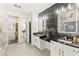 Elegant bathroom featuring dual vanity, black marble countertops, and a separate water closet at 366 Rancho La Costa St, Las Vegas, NV 89138