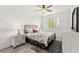 Bright bedroom featuring a black metal bed frame, neutral walls, and wood-look flooring at 366 Rancho La Costa St, Las Vegas, NV 89138