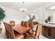 Dining room with wood table and seating for eight with view of stairway at 366 Rancho La Costa St, Las Vegas, NV 89138