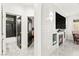 View of a hallway with a fireplace in the living area, and a door leading to the modern bathroom at 366 Rancho La Costa St, Las Vegas, NV 89138