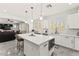 Bright kitchen with white cabinetry, an island, and modern appliances offering a stylish and functional cooking space at 366 Rancho La Costa St, Las Vegas, NV 89138