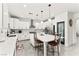Bright kitchen with white cabinetry, stainless steel appliances, and a large center island at 366 Rancho La Costa St, Las Vegas, NV 89138