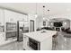 Modern kitchen features stainless steel appliances, white cabinets, and an island with pendant lighting at 366 Rancho La Costa St, Las Vegas, NV 89138