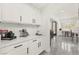 Well-lit kitchen area with white cabinetry, sleek countertops, and modern sink at 366 Rancho La Costa St, Las Vegas, NV 89138