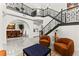 Open living area features a staircase with ornate metal railings and dining area at 366 Rancho La Costa St, Las Vegas, NV 89138
