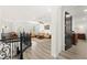 Open-concept living room with wood floors, neutral walls, and cozy seating at 366 Rancho La Costa St, Las Vegas, NV 89138