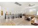 Bright upstairs living area with wood floors, iron railing, and neutral decor showcasing a comfortable and elegant space at 366 Rancho La Costa St, Las Vegas, NV 89138