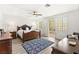 Spacious bedroom with hardwood floors, a ceiling fan, and sliding doors to the outside at 366 Rancho La Costa St, Las Vegas, NV 89138