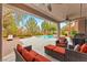 Inviting covered patio with comfortable seating overlooking a pristine pool and landscape at 366 Rancho La Costa St, Las Vegas, NV 89138