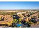 Aerial view of community featuring a pool, mature landscaping, and neighborhood at 3975 N Hualapai Way # 212, Las Vegas, NV 89129