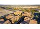 Aerial view showcases colorful condos with sports fields and green spaces nearby at 3975 N Hualapai Way # 212, Las Vegas, NV 89129