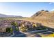An aerial view of a community with a mountain in the distance at 3975 N Hualapai Way # 212, Las Vegas, NV 89129