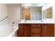 Bathroom with double sinks, vanity, mirror and bathtub at 3975 N Hualapai Way # 212, Las Vegas, NV 89129