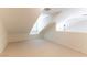 Bright bedroom featuring neutral carpet, sloped ceilings, and a window nook at 3975 N Hualapai Way # 212, Las Vegas, NV 89129