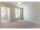 Bedroom with carpet flooring and windows at 3975 N Hualapai Way # 212, Las Vegas, NV 89129