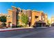 Stunning townhome with a turret, desert landscaping, and attached two-car garage at 3975 N Hualapai Way # 212, Las Vegas, NV 89129